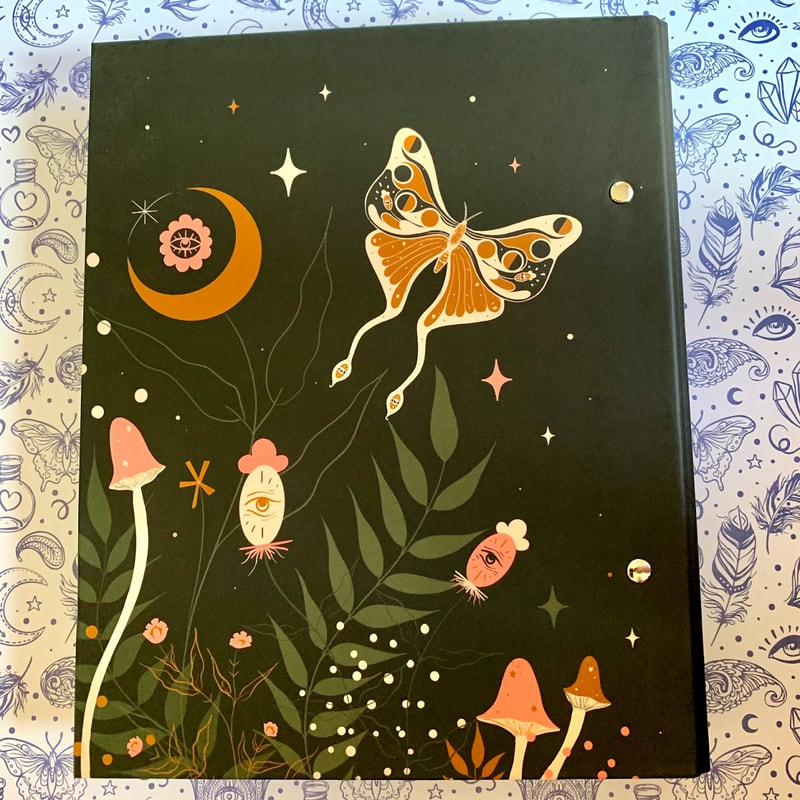 Back of ringbinder with butterfly, stars and moon design